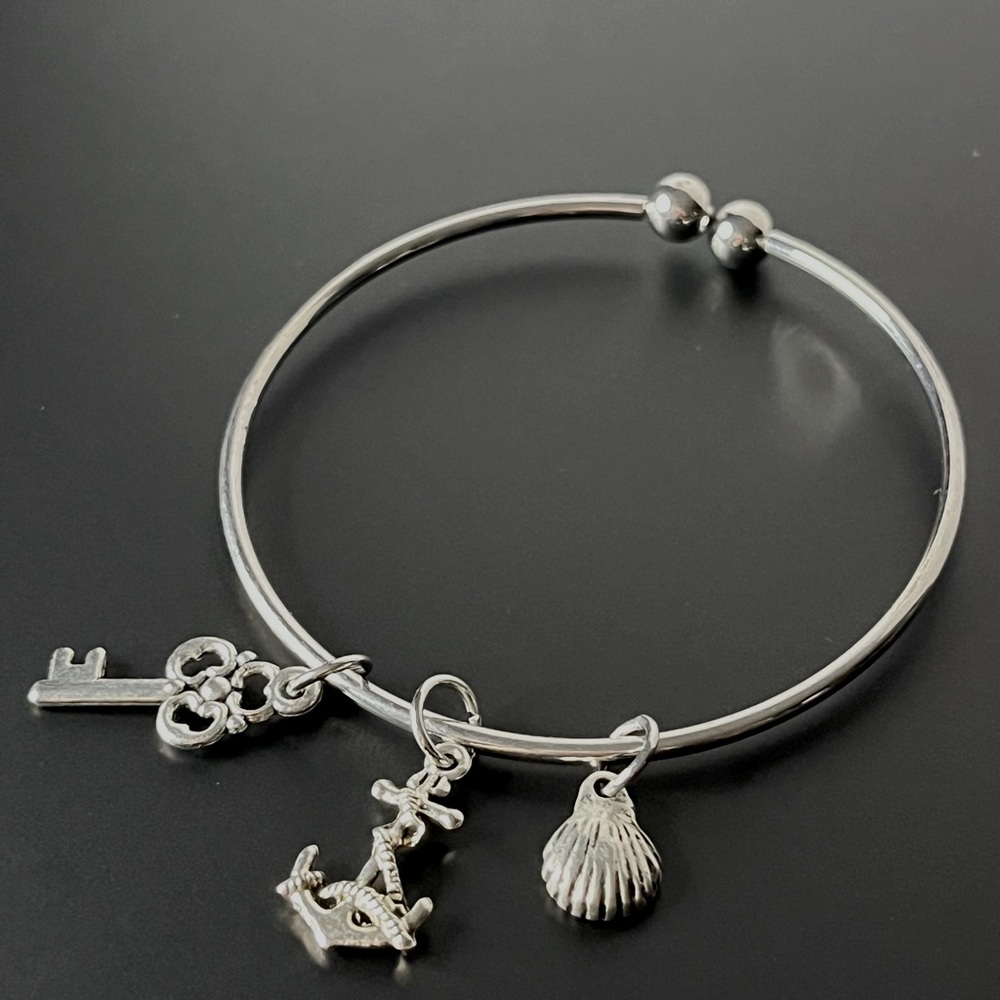 Silver Charm Bracelet with Key, Anchor, and Shell